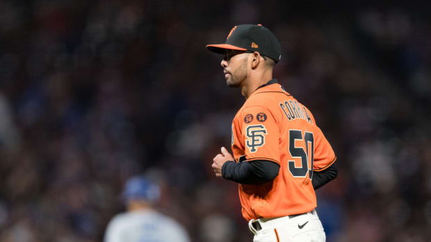 Sep 29, 2023; San Francisco, California, USA; San Francisco Giants interim manager Kai Correa (50) returns to the dugout after living starting pitcher Keaton Winn (67) during the sixth inning of the game against the Los Angeles Dodgers at Oracle Park.